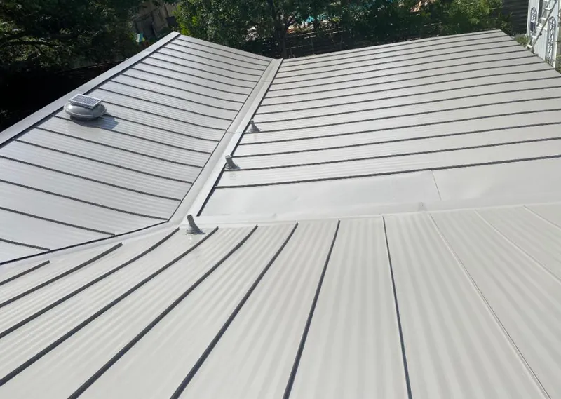 Solar attic fan installed on a metal roof for Roof Ventilation in Oak Grove